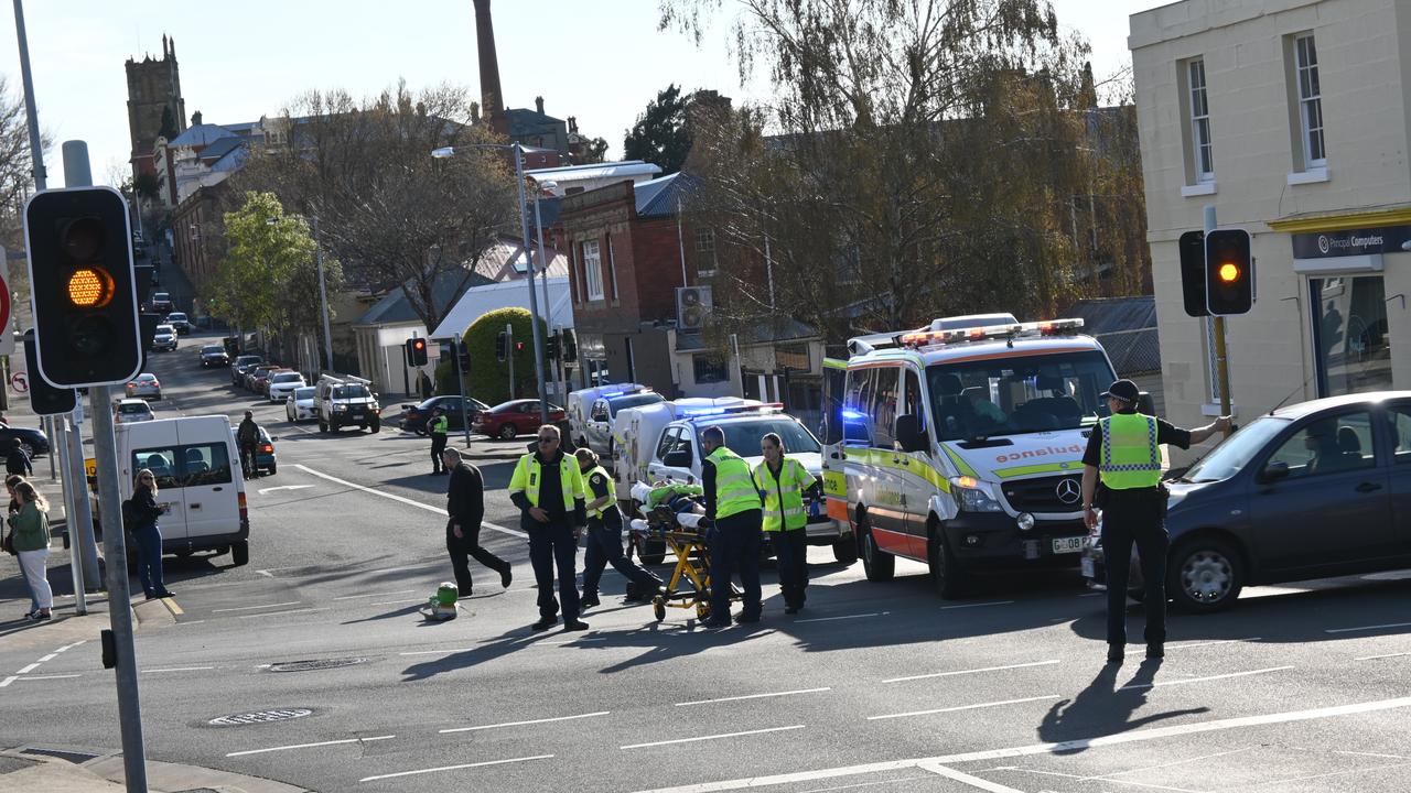 A cyclist has been rushed to hospital after colliding with a car on the intersection of Warwick Street and Harrington Street. Picture: Kenji Sato