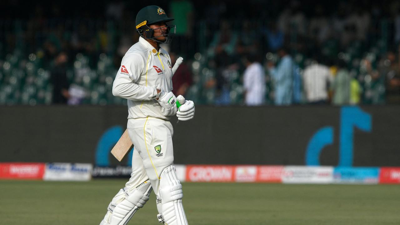 Australia's Usman Khawaja walks back to the pavilion. Photo by Aamir QURESHI / AFP