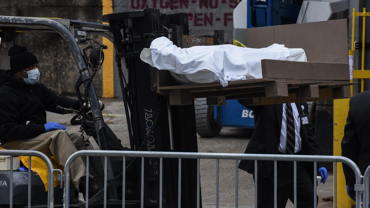 A worker uses a forklift to move a body outside of the Brooklyn Hospital on March 31. Picture: Stephanie Keith/Getty Images/AFP in New York, United States.