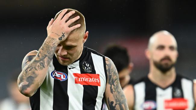 Jordan De Goey of the Magpies looks dejected after losing