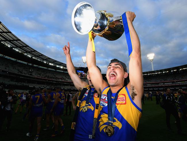 Tom Cole celebrates West Coast’s 2018 premiership.