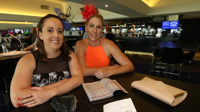 Gold Coast Turf Club members Rebecca Mercieca and Kristy Bath arrived early to claim their favourite table. Picture Mike Batterham