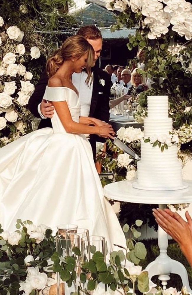 Joel and Brit Selwood cutting their wedding cake. Picture: Instagram/EmmaHawkins