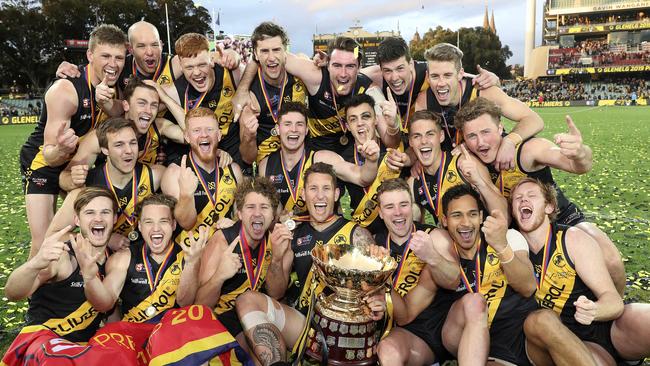 Glenelg celebrate with the Thomas Seymour Hill cup after winning the 2019 SANFL grand final. Picture SARAH REED