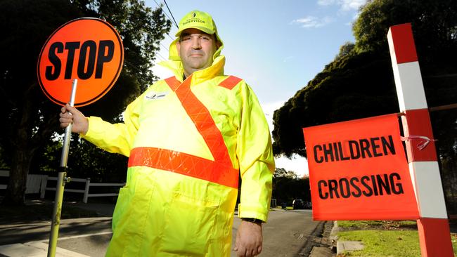 Level crossing supervisor Greg Pump at Deepdene Primary School on the first day of term 2. Picture: Andrew Henshaw