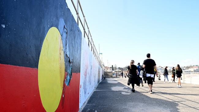 The Aboriginal flag painted on the promenade at Bondi beach. Picture: NCA NewsWire / Jeremy Piper