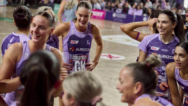 Isabelle Shearer and her Firebirds teammates celebrate their epic win over the West Coast Fever in the Suncorp Super Netball.