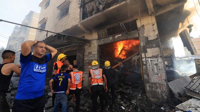 Palestinian rescuers arrive at the scene after an Israeli strike in Khan Yunis in the southern Gaza Strip. Picture: AFP