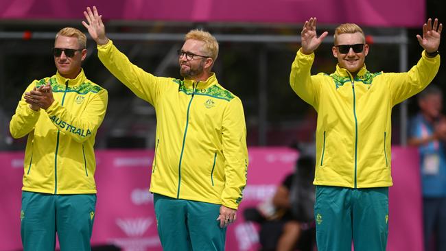 Barry Lester (L), Carl Healey (C) and Ben Twist (R) of Team Australia celebrate during the Men's Triples medal ceremony.