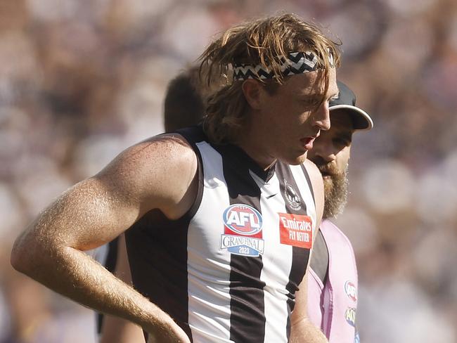 MELBOURNE, AUSTRALIA - SEPTEMBER 30: Nathan Murphy of the Magpies leaves the field with trainers during the 2023 AFL Grand Final match between Collingwood Magpies and Brisbane Lions at Melbourne Cricket Ground, on September 30, 2023, in Melbourne, Australia. (Photo by Daniel Pockett/AFL Photos/via Getty Images)