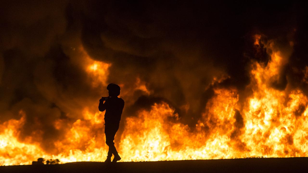 A field of fire after a rocket launched from Gaza struck Ramla within Israel. Picture: Amir Levy/Getty Images