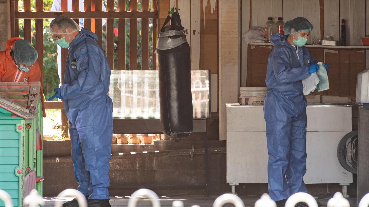 Forensics officers at an address on Wishart Rd at Mt Gravatt. Picture: Brad Fleet