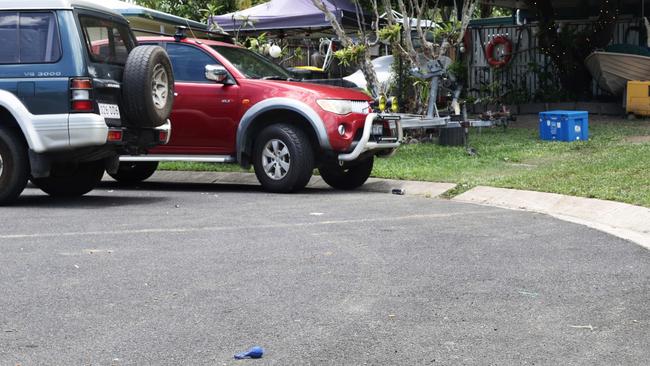 Cans of alcohol and balloons used for inhaling substances littered the road. Picture: Brendan Radke