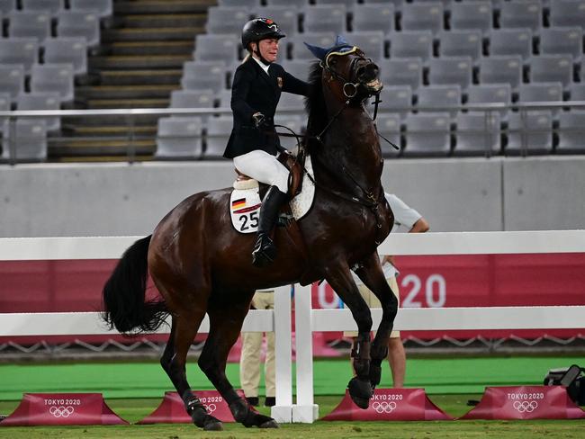 Germany's Annika Schleu struggles in the women's individual riding show jumping modern pentathlon. Picture: AFP