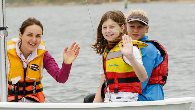 Oksana Makohon, Hafiia Nahirniak and Mornington Yacht Club member Lucy Laverty on the water at Mornington. Picture: Al Dillon