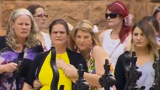 Zoe’s mother Janelle Saunders (centre) is supported by friends and relatives at the funeral of her murdered daughter, 11, in Wangaratta. Picture: Channel 7