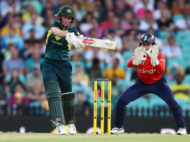 SYDNEY, AUSTRALIA - JANUARY 20: Beth Mooney of Australia hits hard down the ground during game one of the Women's Ashes T20 International series between Australia and England at Sydney Cricket Ground on January 20, 2025 in Sydney, Australia. (Photo by Jeremy Ng/Getty Images)