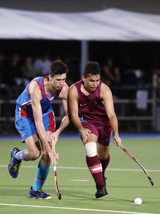 Saints captain Aden Conlan and Brothers captain Declan O'Brien fight for possession in the Cairns Hockey Association U18 Men's Grand Final between Brothers and Saints. PICTURE: BRENDAN RADKE