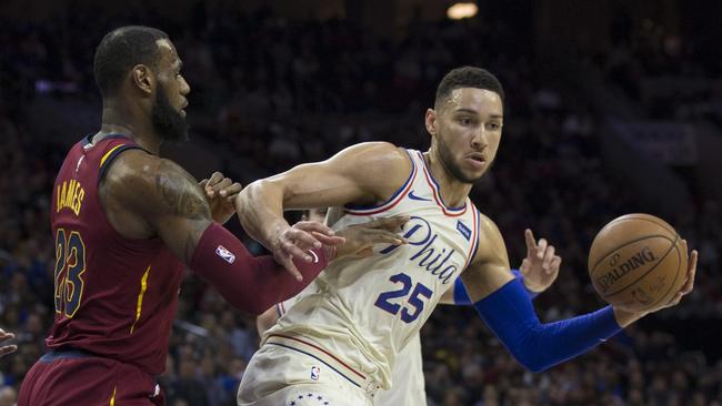 PHILADELPHIA, PA - APRIL 6: Ben Simmons #25 of the Philadelphia 76ers controls the ball against LeBron James #23 of the Cleveland Cavaliers in the first quarter at the Wells Fargo Center on April 6, 2018 in Philadelphia, Pennsylvania. NOTE TO USER: User expressly acknowledges and agrees that, by downloading and or using this photograph, User is consenting to the terms and conditions of the Getty Images License Agreement.   Mitchell Leff/Getty Images/AFP == FOR NEWSPAPERS, INTERNET, TELCOS & TELEVISION USE ONLY ==