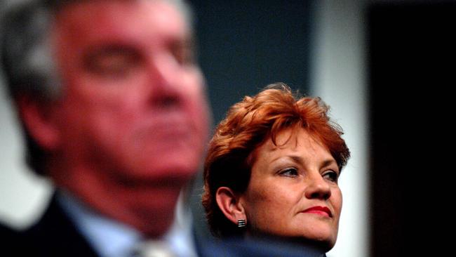 Pauline Hanson with an image of Ron Boswell in the background during a declaration of Queensland Senate candidates. Picture: Patrick Hamilton