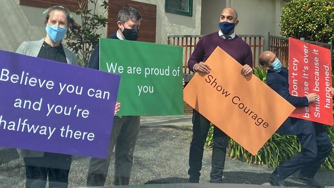 Oxley College teachers stage a drive-through graduation parade for Year 12 students.