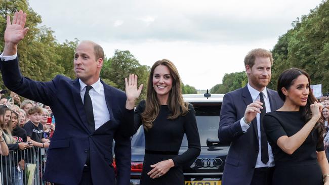 Britain's Prince William, Prince of Wales, Catherine, Princess of Wales, Prince Harry, Duke of Sussex, and Meghan, Duchess of Sussex wave at wellwishers on the Long Walk at Windsor Castle. Picture: Chris Jackson/Pool/AFP