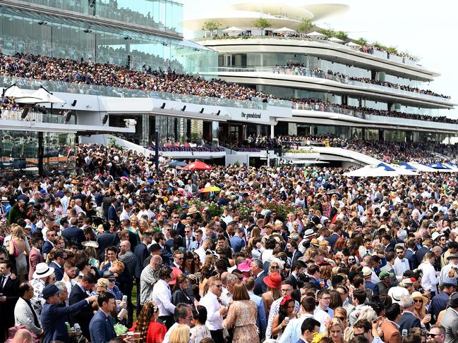 MELBOURNE, AUSTRALIA - NOVEMBER 05: A big crowd watches on during 2019 Melbourne Cup Day at Flemington Racecourse on November 05, 2019 in Melbourne, Australia. (Photo by Quinn Rooney/Getty Images)