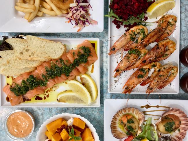 Concord Seafood’s BBQ Aussie prawns, BBQ scallops, salmon carpaccio, pumpkin salads andand fish & chips. Picture: Jenifer Jagielski