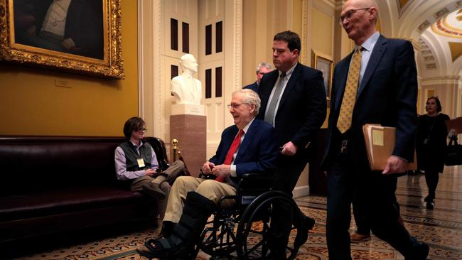 Mitch McConnell is pushed in a wheelchair at the US Capitol. Picture: Getty Images via AFP.