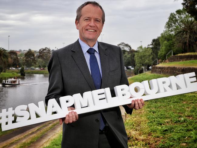 Federal opposition and Labor Party leader as well as local MP for Maribyrnong, Bill Shorten holds a #SNAPMELBOURNE sign on the banks of the Maribyrnong River as the Blackbird boat goes by on Wednesday, October 26, 2016, in Moonee Ponds, Victoria, Australia. Picture: Hamish Blair