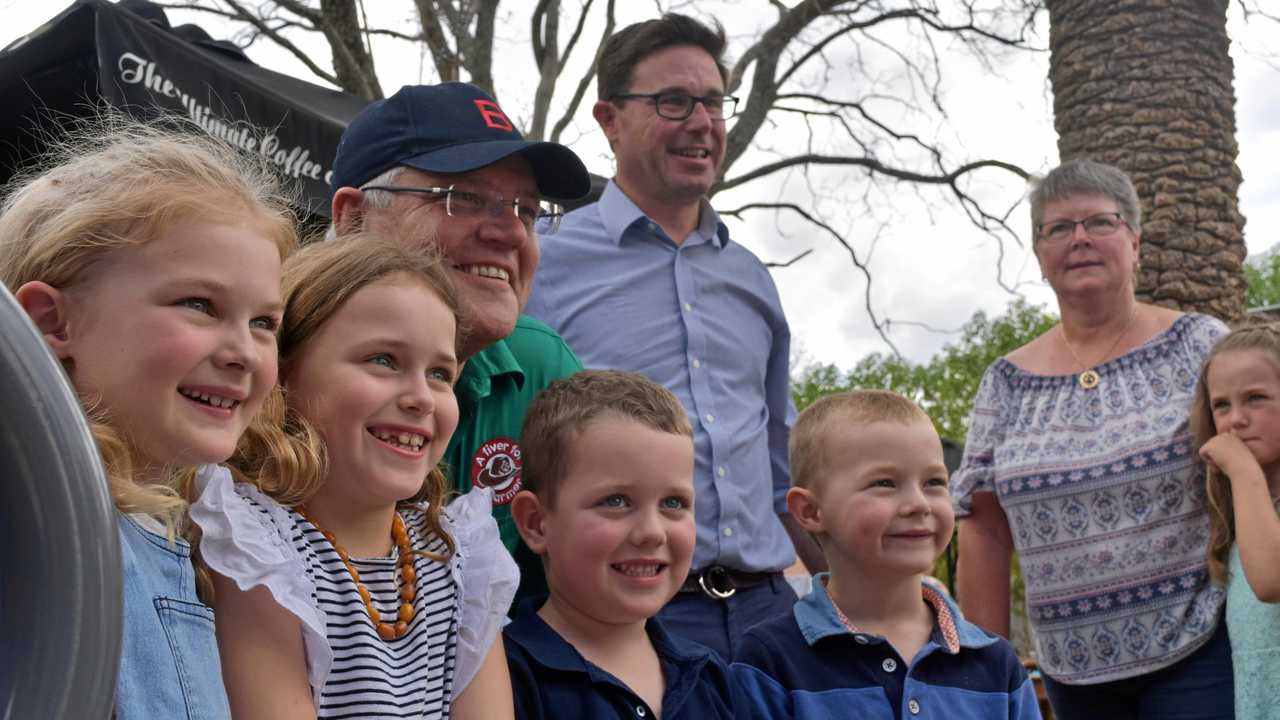 LITTLE FANS: Scott Morrison and some of his tiniest fans in Dalby. Picture: Meg Gannon