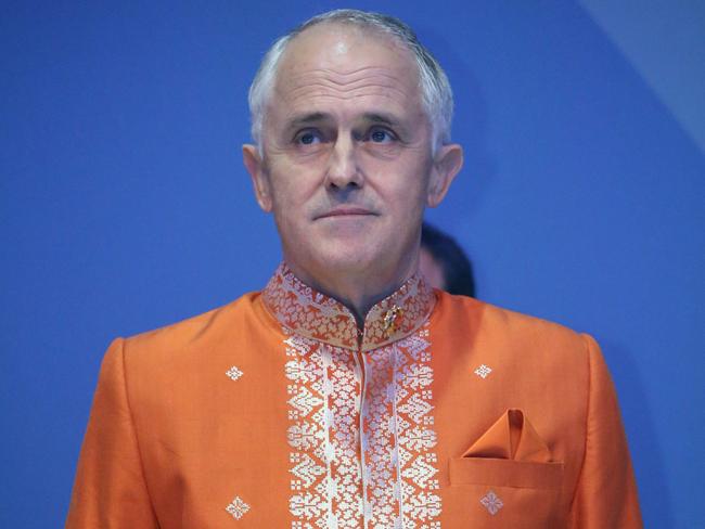 ASEAN: Job ID GR2111201503. The Australian Prime Minister Malcolm Turnbull during the ASEAN leaders Summit in Kuala Lumpur. Prime Minister Malcolm Turnbull dressed in a bright orange shirt for the ASEAN Galla dinner. 21st November 2015. Picture Gary Ramage