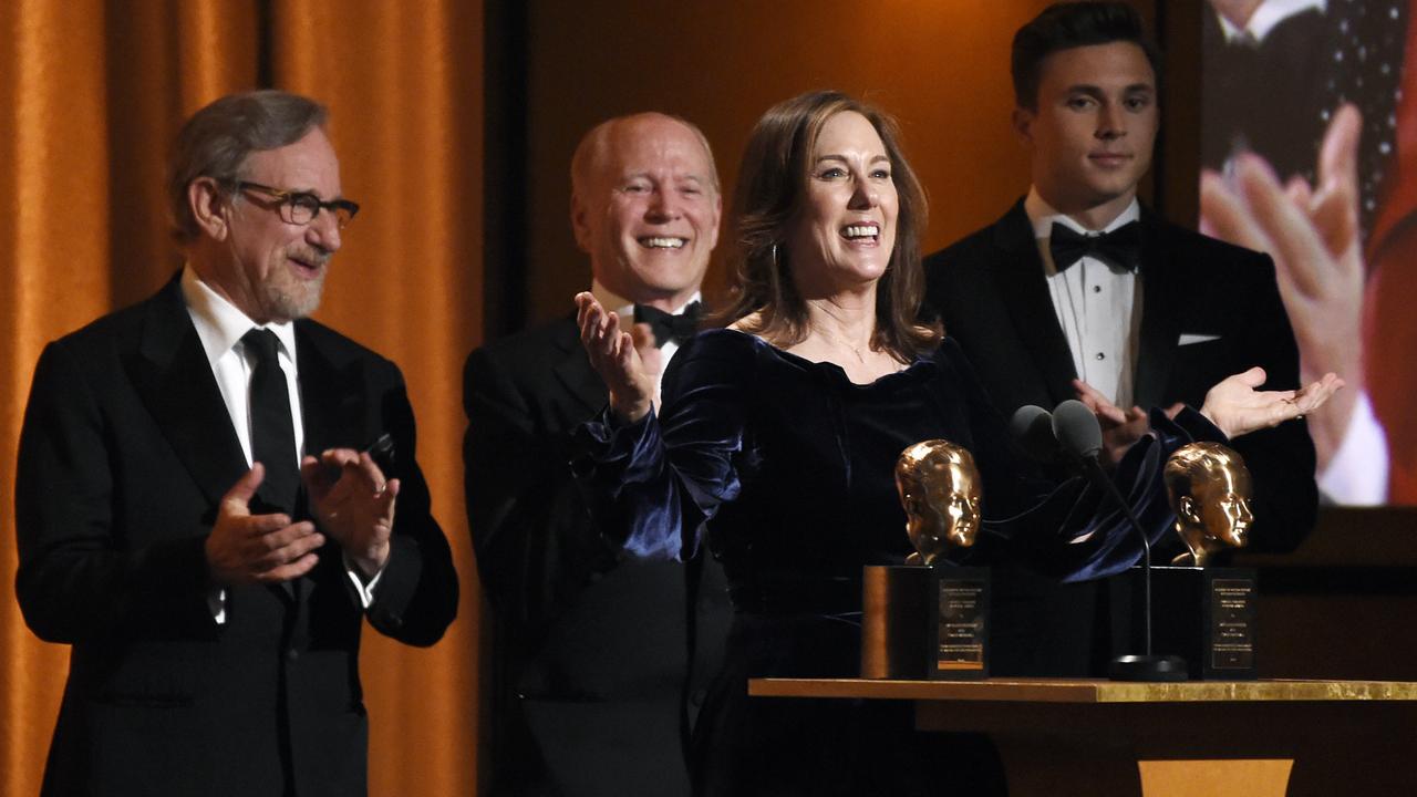 Producer Kathleen Kennedy addresses the audience after she and her husband Frank Marshall, second from left, were given the Irving G. Thalberg Memorial Award.