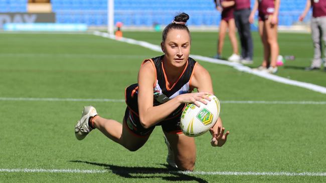 Paige Markey scoring for the Tigers in the touch football competition. Pic: Peter Tong