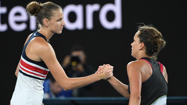 Karolina Pliskova shakes hands with Barbora Strycova after last night’s match. Picture: AFP