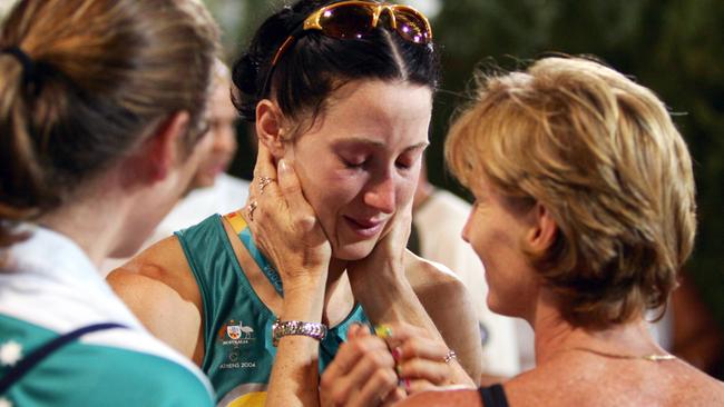 Jana Pittman, is comforted by former athlete Debbie Flintoff-King (R), after her fifth place in final of women's 400 hurdle at Olympic Stadium during 2004 Games in Athens. Picture: Craig Borrow.