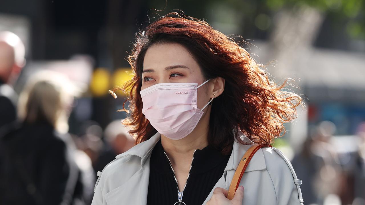 People wearing masks in Brisbane. Picture: Liam Kidston