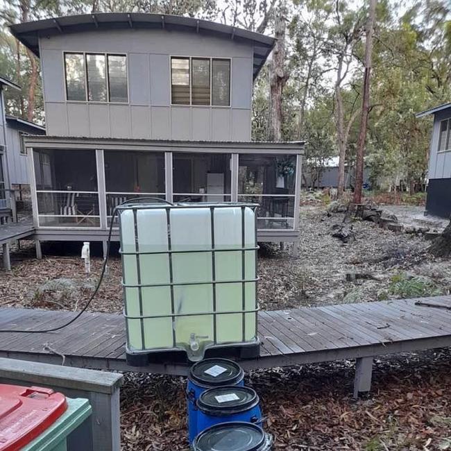 Couran Cove residents have been using water tanks after their water supply was disconnected.