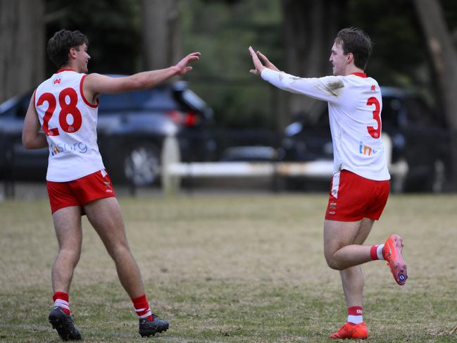 OEFN Senior Football. Premier Data Premier Division Seniors, Round 7. Olinda Ferny Creek Seniors vs Healesville Seniors, played at Olinda Recreation Reserve, Olinda, Victoria, Saturday 24th May 2025. Olinda Ferny Creek Seniors player Ned Ford kicks a goal and celebrates with teammate Josh Wallis. Picture: Andrew Batsch