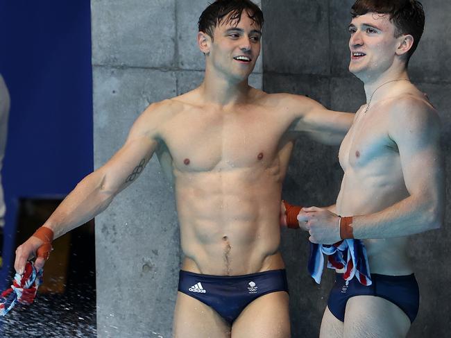 TOKYO, JAPAN - JULY 26: Tom Daley and Matty Lee of Team Great Britain look celebrate after their final dive during the Men's Synchronised 10m Platform Final on day three of the Tokyo 2020 Olympic Games at Tokyo Aquatics Centre on July 26, 2021 in Tokyo, Japan. (Photo by Clive Rose/Getty Images)