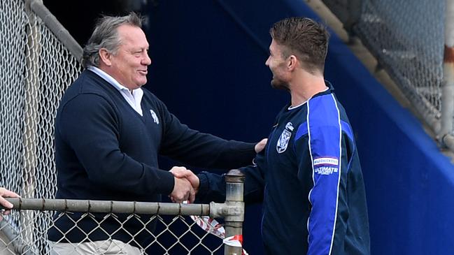 Bulldogs great Terry Lamb shakes hands with Kieran Foran at training on Thursday. Picture: AAP