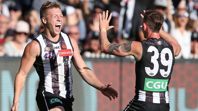 De Goey celebrates a goal with best mate Ben Crocker. Picture: Michael Klein