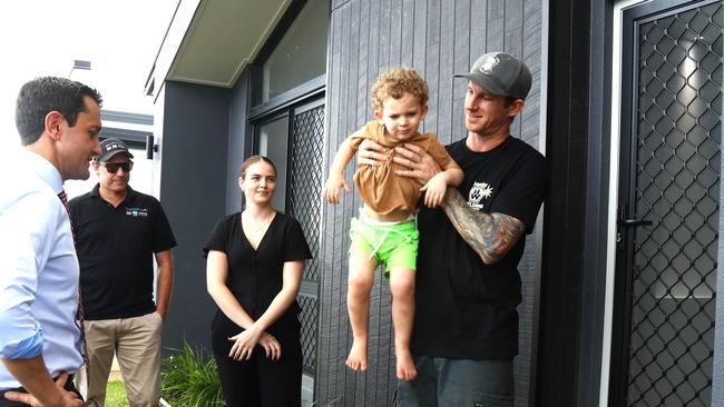 Premier David Crisafulli visits a new housing development at Bentley Park, Cairns and spoke with first homebuyer Aidan Maxwell and son Harry. Picture: Peter Carruthers