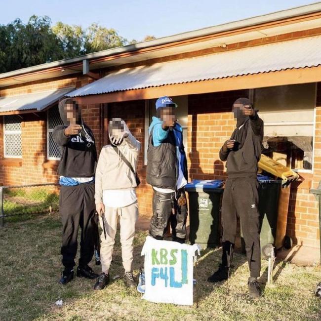 Youths with a KBS sign at the same Kilburn house where the shooting happened. The residents are not pictured. Pictures: 7NEWS.