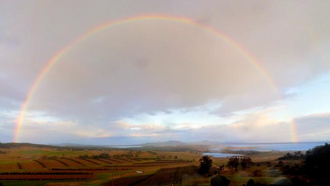 Stitched panorama of a late afternoon double rainbow looking eastward towards Freycinet National Park. Picture: YOAV DANIEL BAR-NESS