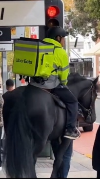 Horse-riding Uber Eats worker trots through Sydney