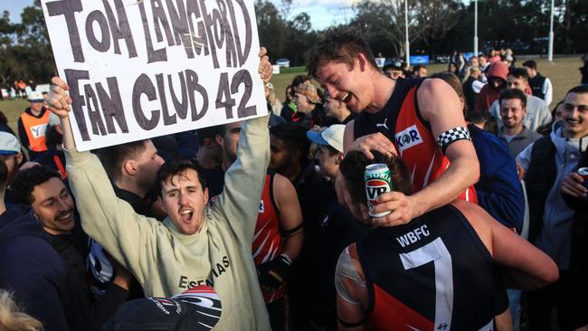 Blues fans and players celebrate the 2022 flag win. Picture: Davis Harrigan