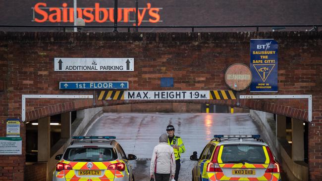 Police cordon off the upper level of a supermarket opposite the park bench where Sergei Skripal and his daughter were found in Salisbury, England. Picture: Getty Images