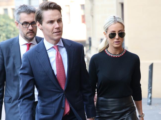 Pic of Oliver Curtis and wife Roxy Jacenko leaving St Jame rd court today. Curtis is facing charges of insider trading