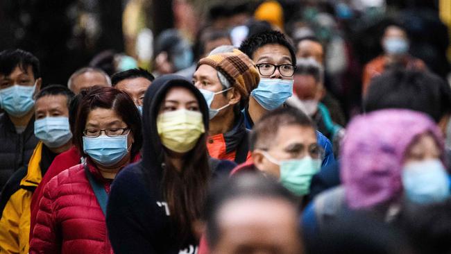 People wearing face masks in Hong Kong. Picture: Anthony Wallace / AFP.